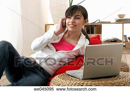 at-home, cell phone, calling, brunette, 20's View Large Photo Image Stock Photography - at-home, cell phone, calling, brunette, 20's. Fotosearch