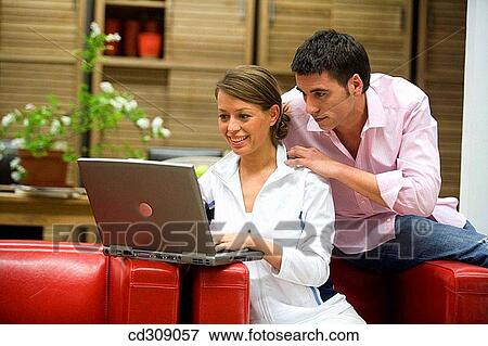 Stock Photo - at-home, chair, 30's. Fotosearch