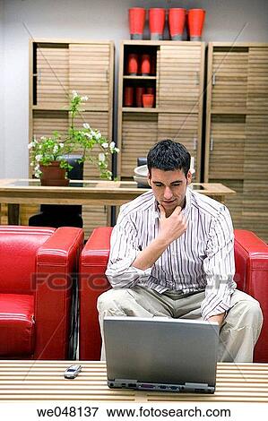 at-home, chair, cell phone, 30's View Large Photo Image Stock Photo - at-home, chair, cell phone, 30's. Fotosearch