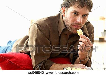 Stock Image - at-home, chip, absorbed. Fotosearch