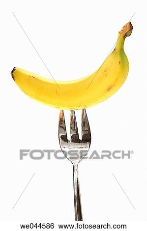 Banana on a fork View Large Photo Image Stock Photograph - Banana on a fork. Fotosearch