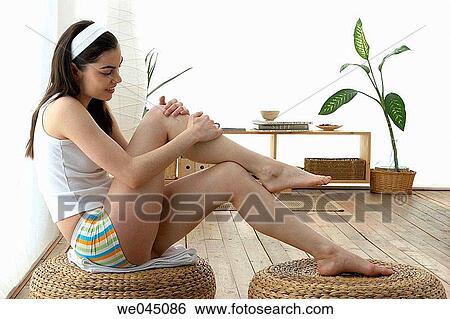 barefoot, brunette, Body care, at-home View Large Photo Image Stock Photograph - barefoot, brunette, Body care, at-home. Fotosearch