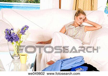 Stock Image - barefoot, calm, blond, at-home. Fotosearch