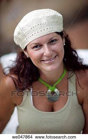 Picture - beret, brunette, anticipation. Fotosearch