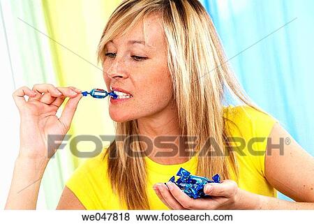 bite, biting, blond, calorie, candy View Large Photo Image Stock Photo - bite, biting, blond, calorie, candy. Fotosearch