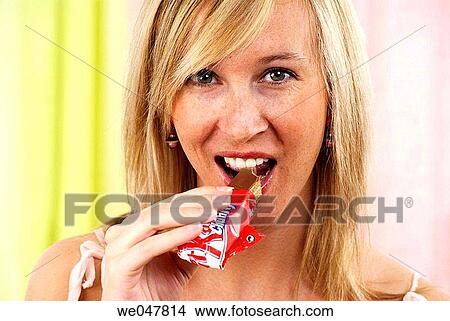 bite, biting, blond, calorie View Large Photo Image Picture - bite, biting, blond, calorie. Fotosearch