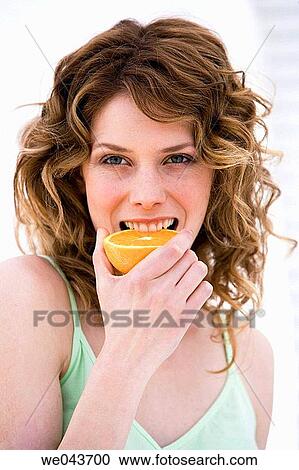 bite, Citrus fruit, biting, 20's View Large Photo Image Stock Image - bite, Citrus fruit, biting, 20's. Fotosearch