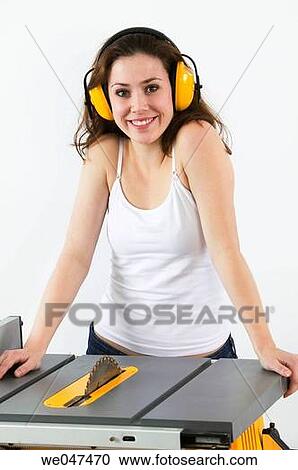 Stock Image - blue-collar, brunette, Blue-collar worker, at-home. Fotosearch