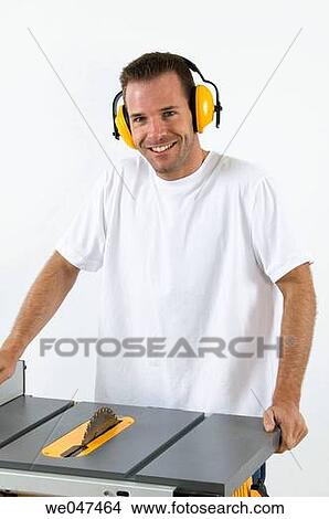Picture - blue-collar, Circular saw, Blue-collar worker, at-home. Fotosearch