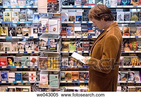 Stock Photography - book, browsing, browse, bookshop, 30's. Fotosearch