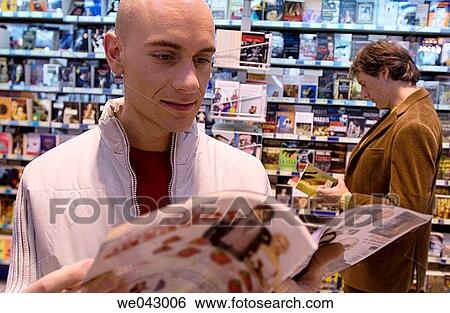 bookshop, browsing, browse, 30's View Large Photo Image Stock Photograph - bookshop, browsing, browse, 30's. Fotosearch