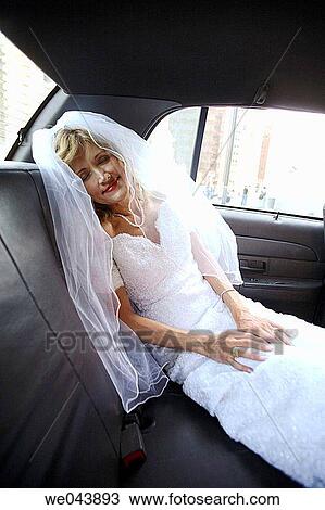 Bride asleep in back of taxi cab View Large Photo Image Stock Image - Bride asleep in back of taxi cab. Fotosearch