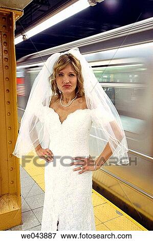 Bride in nyc subway snarling at camera as subway goes by View Large Photo Image Stock Photo - Bride in nyc subway snarling at camera as subway goes by. Fotosearch
