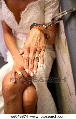 Bride/woman handcuffed to wall View Large Photo Image Picture - Bride/woman handcuffed to wall. Fotosearch