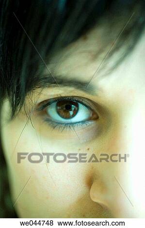 Stock Photo - Brown eye, brunette, Close-up. Fotosearch