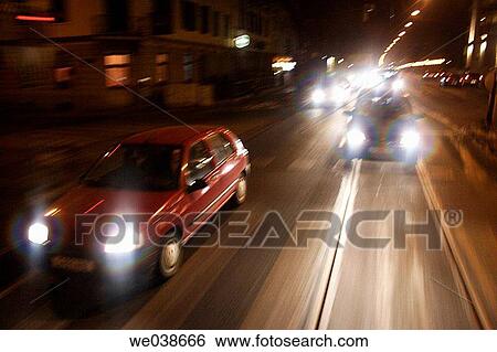 Stock Photograph - Cars seen from the rear window of a tramway. Graz, Styria, Austria, Europe.. Fotosearch