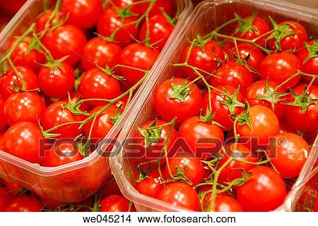 Cherry tomatoes in plastic boxes. Mercado de la Boquer? a. Barcelona. Spain. View Large Photo Image Picture - Cherry tomatoes in plastic boxes. Mercado de la Boquer? a. Barcelona. Spain.. Fotosearch