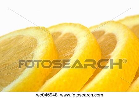 Close-up of lemon slices View Large Photo Image Stock Photo - Close-up of lemon slices. Fotosearch