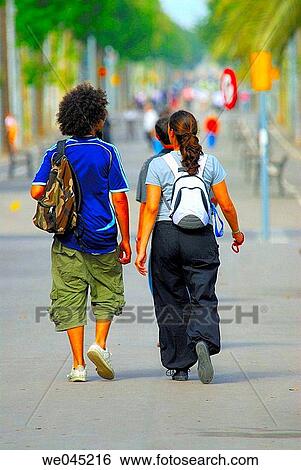 Couple walking. Barcelona. Spain. View Large Photo Image Stock Photograph - Couple walking. Barcelona. Spain.. Fotosearch