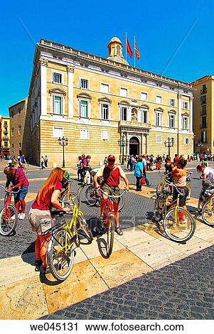 Cyclists in front of Palau de la Generalitat in Pla? a de Sant Jaume, Barcelona. Catalonia, Spain View Large Photo Image Stock Image - Cyclists in front of Palau de la Generalitat in Pla? a de Sant Jaume, Barcelona. Catalonia, Spain. Fotosearch