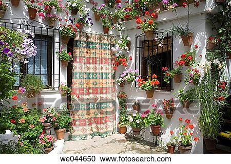 Stock Image - Detail of flower bedecked patio. Cordoba, Andalusia, Spain. Fotosearch