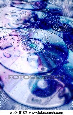 Stock Image - Discs covered with water drops. Information Leak. August 2004, Maryland, USA. Fotosearch