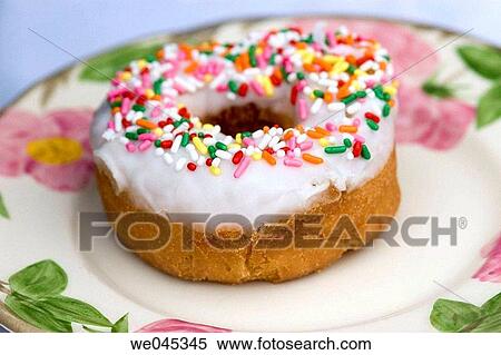 Donut with white frosting and rainbow colors sprinkles View Large Photo Image Stock Photography - Donut with white frosting and rainbow colors sprinkles. Fotosearch