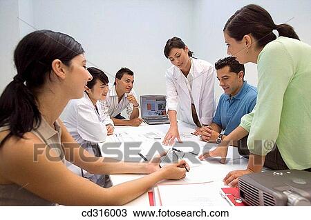 Stock Image - Fatronik Research Centre, San Sebastian Technological Park, Donostia, Gipuzkoa, Basque Country. Business people and technicians looking at blueprints. Fotosearch