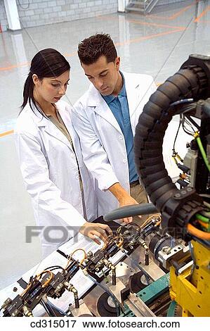 Fatronik Research Centre, San Sebastian Technological Park, Donostia, Gipuzkoa, Basque Country. Advanced industrial robotic system, final assembly of the motor drive. View Large Photo Image Stock Photo - Fatronik Research Centre, San Sebastian Technological Park, Donostia, Gipuzkoa, Basque Country. Advanced industrial robotic system, final assembly of the motor drive.. Fotosearch