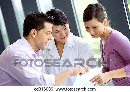 Stock Photograph - Fatronik Research Centre, San Sebastian Technological Park, Donostia, Gipuzkoa, Basque Country. Business people and technician at the office. Fotosearch