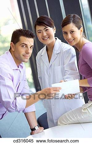 Stock Photography - Fatronik Research Centre, San Sebastian Technological Park, Donostia, Gipuzkoa, Basque Country. Business people and technician at the office. Fotosearch