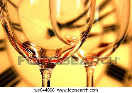Glasses and clock in background View Large Photo Image Stock Photo - Glasses and clock in background. Fotosearch
