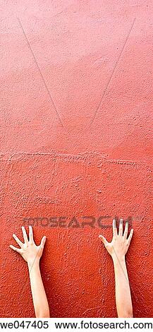 Hand on red wall View Large Photo Image Stock Photography - Hand on red wall. Fotosearch