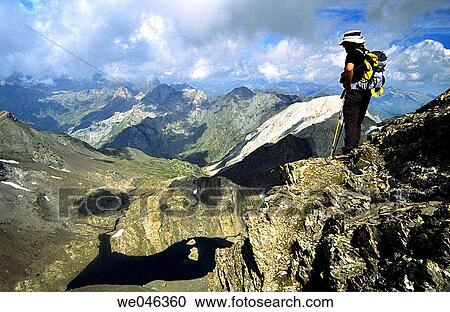 Hiker. Troumouse cirque. Parque Nacional Ordesa y Monte Perdido area. Pyr? n? es. Huesca province. Aragon. Spain. View Large Photo Image Stock Image - Hiker. Troumouse cirque. Parque Nacional Ordesa y Monte Perdido area. Pyr? n? es. Huesca province. Aragon. Spain.. Fotosearch