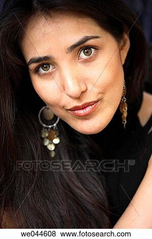 Hispanic/latin woman looking into the camera View Large Photo Image Stock Photo - Hispanic/latin woman looking into the camera. Fotosearch