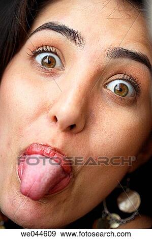Hispanic/latin woman stucking her tongue out View Large Photo Image Stock Photo - Hispanic/latin woman stucking her tongue out. Fotosearch