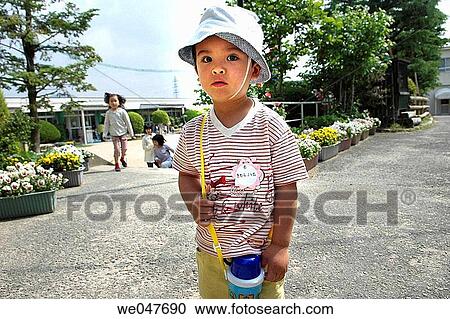 Japanese child in the garden of the maternal school View Large Photo Image Stock Image - Japanese child in the garden of the maternal school. Fotosearch