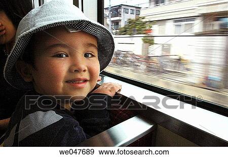 Stock Photo - Japanese child in train. Fotosearch