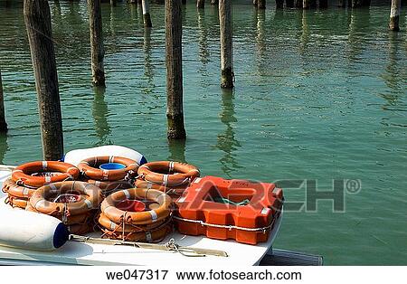 Stock Photo - Life belts on passenger boat to Venecia with tourists from port Sabbioni.. Fotosearch
