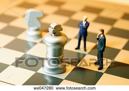 Miniature Businessman on Chess Board View Large Photo Image Stock Image - Miniature Businessman on Chess Board. Fotosearch