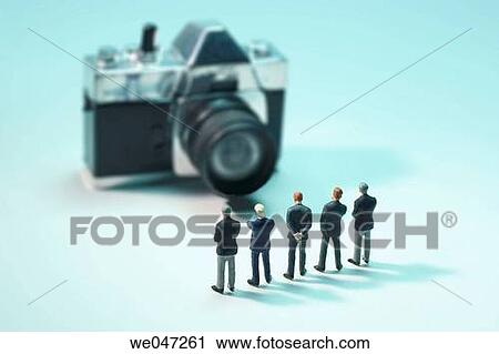 Miniature Businessmen and Camera View Large Photo Image Stock Image - Miniature Businessmen and Camera. Fotosearch