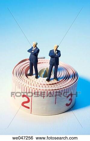 Miniature Businessmen and Tape Measure View Large Photo Image Stock Photograph - Miniature Businessmen and Tape Measure. Fotosearch