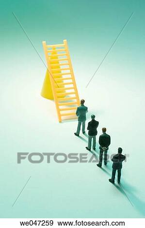 Miniature Businessmen and Toy Ladder View Large Photo Image Stock Photo - Miniature Businessmen and Toy Ladder. Fotosearch