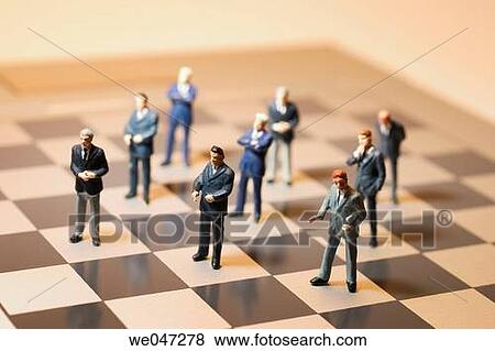 Miniature Businessmen on Chess Board View Large Photo Image Stock Photo - Miniature Businessmen on Chess Board. Fotosearch