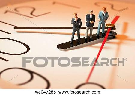 Miniature Businessmen on Clock View Large Photo Image Stock Photography - Miniature Businessmen on Clock. Fotosearch