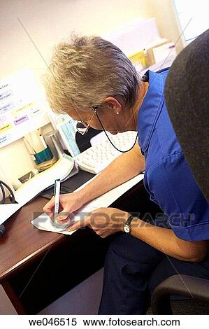 Nurse at surgery writing notes. View Large Photo Image Stock Photography - Nurse at surgery writing notes.. Fotosearch