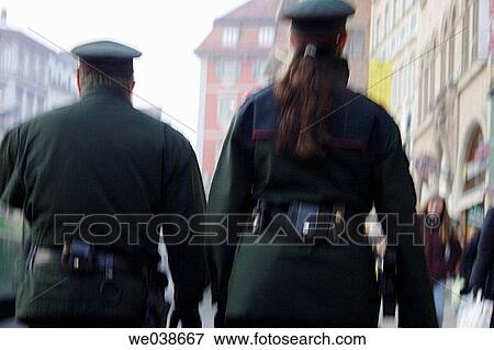 Police officers patrolling in a city. View Large Photo Image Stock Photo - Police officers patrolling in a city.. Fotosearch