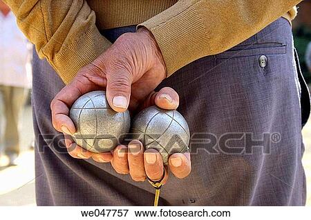 Stock Photo - Senior man playing boules. Fotosearch