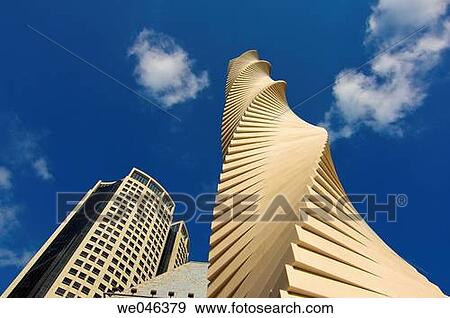 Singapore, Marina Square, modern sculpture with high rise buildings View Large Photo Image Stock Photo - Singapore, Marina Square, modern sculpture with high rise buildings. Fotosearch