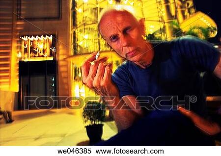 Thailand, Bangkok, Siam Paragon Shopping Centre, French-Canadian artist sitting outside with cigarette, MR_0604-0003-Cla View Large Photo Image Stock Photography - Thailand, Bangkok, Siam Paragon Shopping Centre, French-Canadian artist sitting outside with cigarette, MR_0604-0003-Cla. Fotosearch